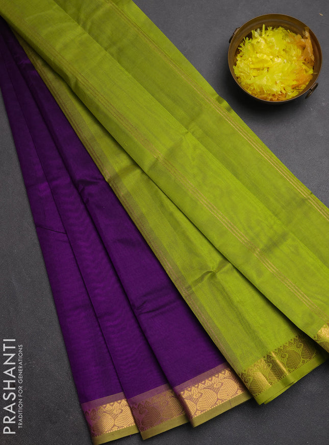 Silk cotton saree purple and light green with plain body and paisley zari woven border