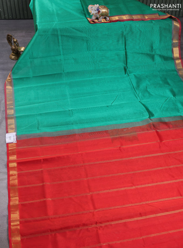 Silk cotton saree teal green and red with plain body and temple zari woven border