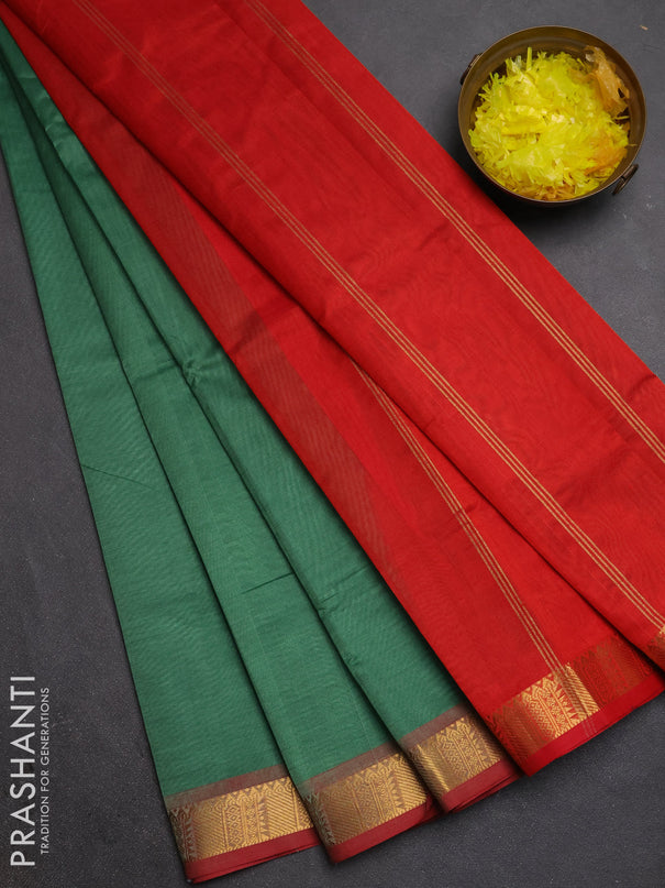 Silk cotton saree green and red with plain body and temple zari woven border