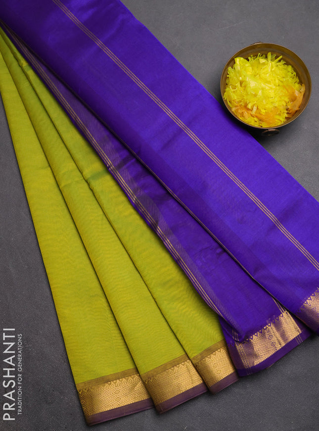 Silk cotton saree light green and violet with plain body and zari woven border