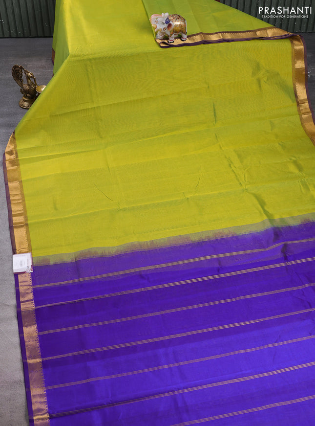 Silk cotton saree light green and violet with plain body and zari woven border