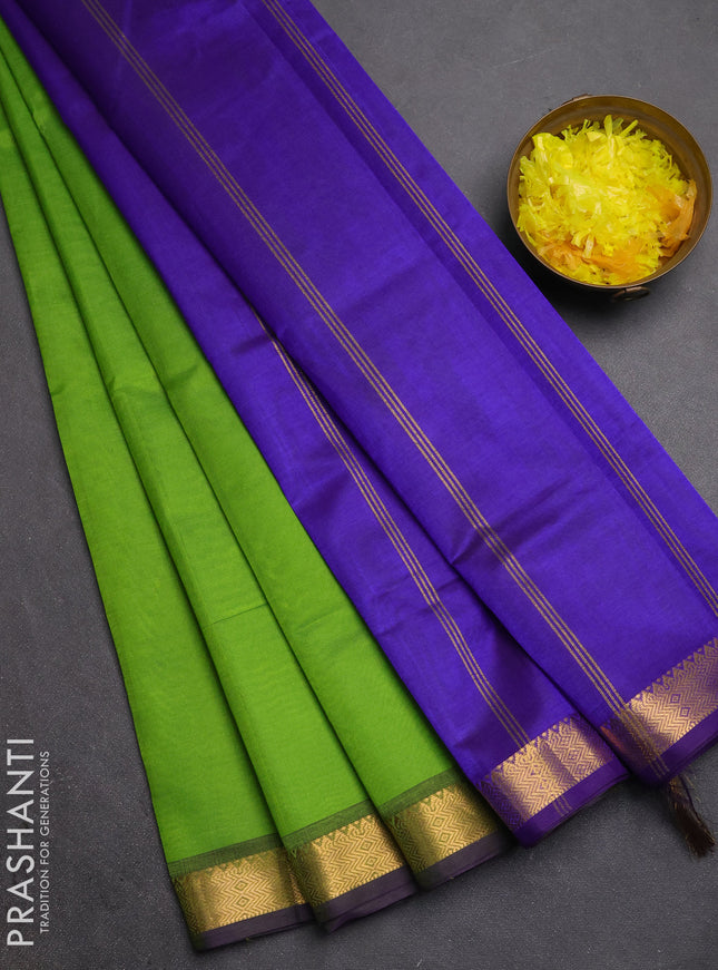 Silk cotton saree light green and violet with plain body and zari woven border