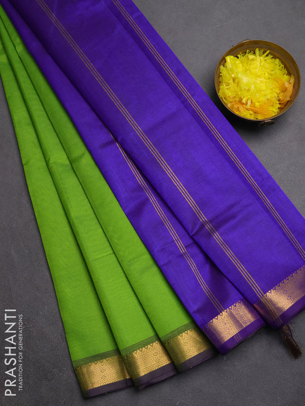 Silk cotton saree light green and violet with plain body and zari woven border