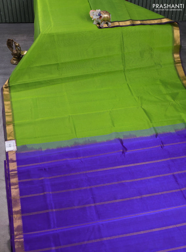 Silk cotton saree light green and violet with plain body and zari woven border