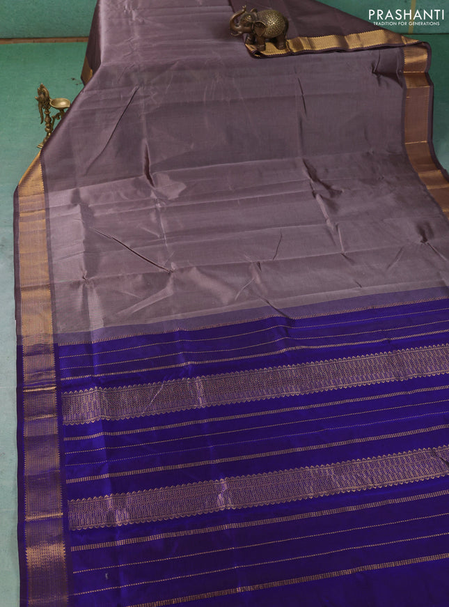 Silk cotton saree grey and royal blue with plain body and temple zari woven border