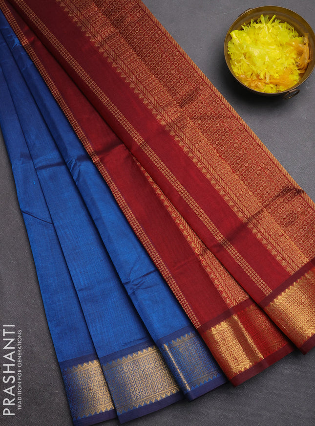 Silk cotton saree peacock blue and maroon with plain body and temple zari woven border