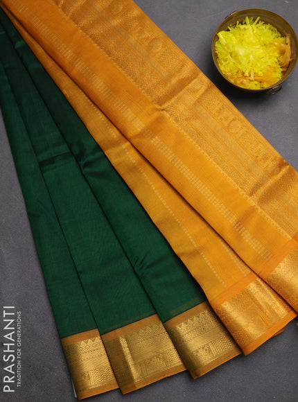 Silk cotton saree bottle green and mustard yellow with plain body and temple zari woven border