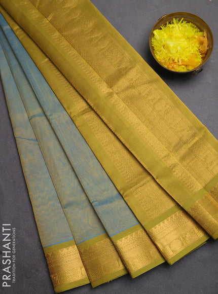Silk cotton saree teal blue and mustard green with plain body and temple zari woven border