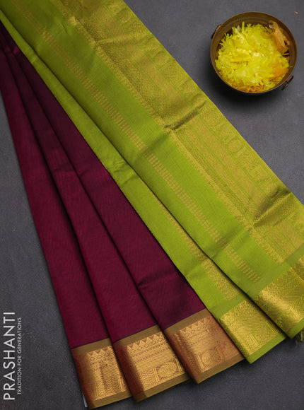 Silk cotton saree deep wine and light green with plain body and zari woven border