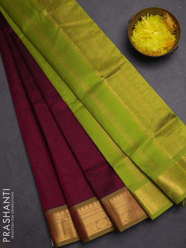 Silk cotton saree deep wine and light green with plain body and zari woven border