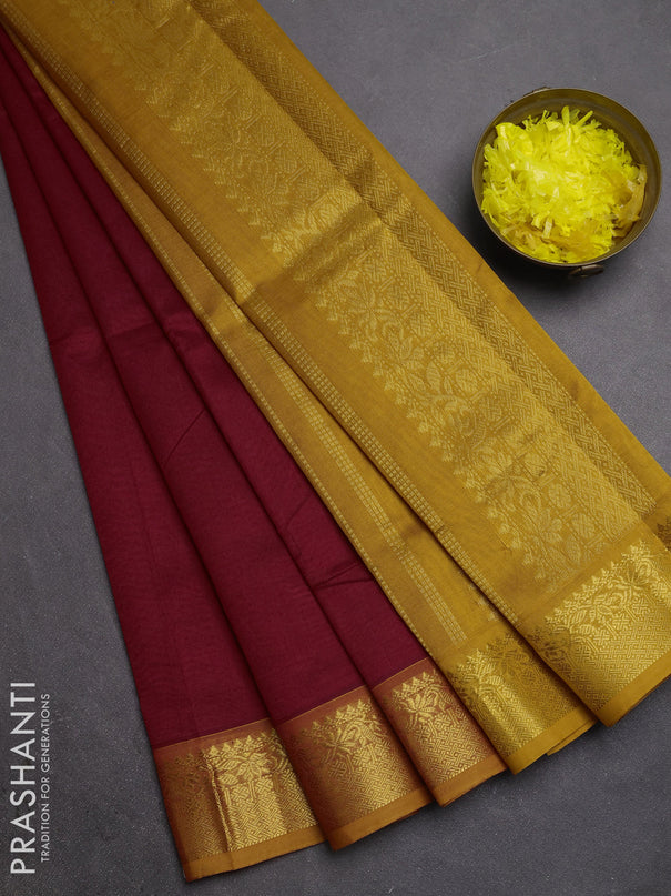 Silk cotton saree maroon and mustard yellow with plain body and zari woven border