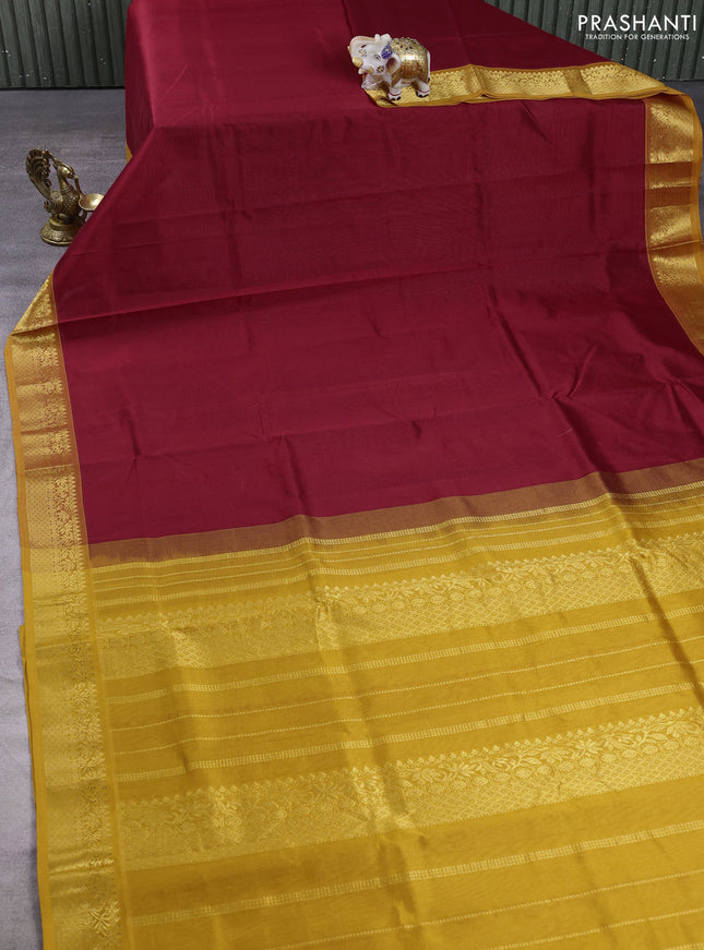 Silk cotton saree maroon and mustard yellow with plain body and zari woven border