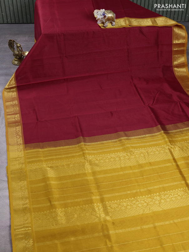 Silk cotton saree maroon and mustard yellow with plain body and zari woven border