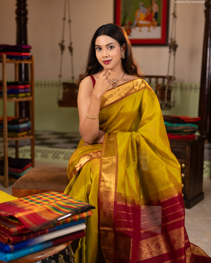 Silk cotton saree mustard green and maroon with plain body and zari woven border