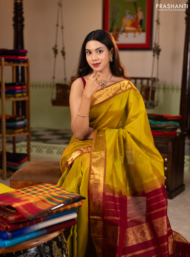 Silk cotton saree mustard green and maroon with plain body and zari woven border