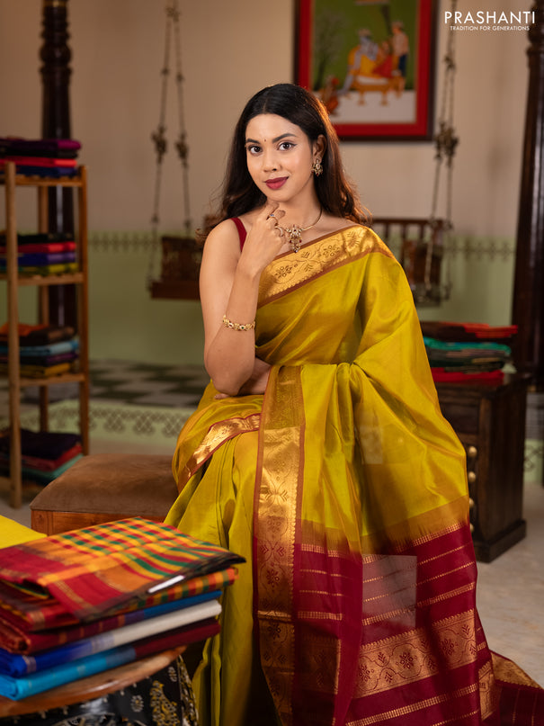Silk cotton saree mustard green and maroon with plain body and zari woven border
