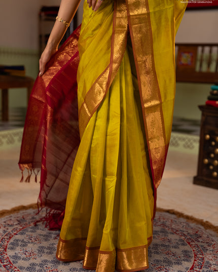 Silk cotton saree mustard green and maroon with plain body and zari woven border