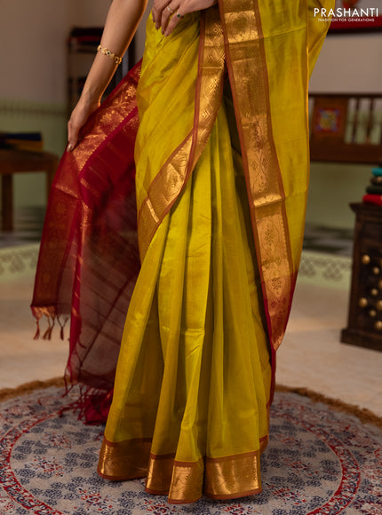 Silk cotton saree mustard green and maroon with plain body and zari woven border