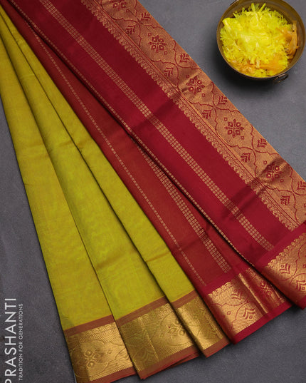 Silk cotton saree mustard green and maroon with plain body and zari woven border