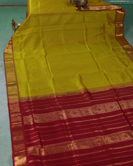Silk cotton saree mustard green and maroon with plain body and zari woven border