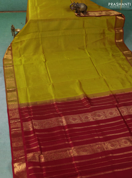 Silk cotton saree mustard green and maroon with plain body and zari woven border