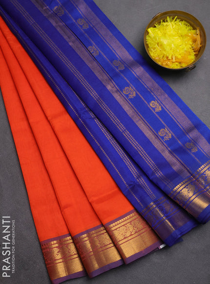 Silk cotton saree orange and navy blue with plain body and zari woven border