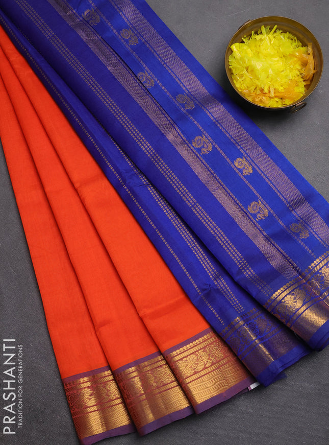 Silk cotton saree orange and navy blue with plain body and zari woven border