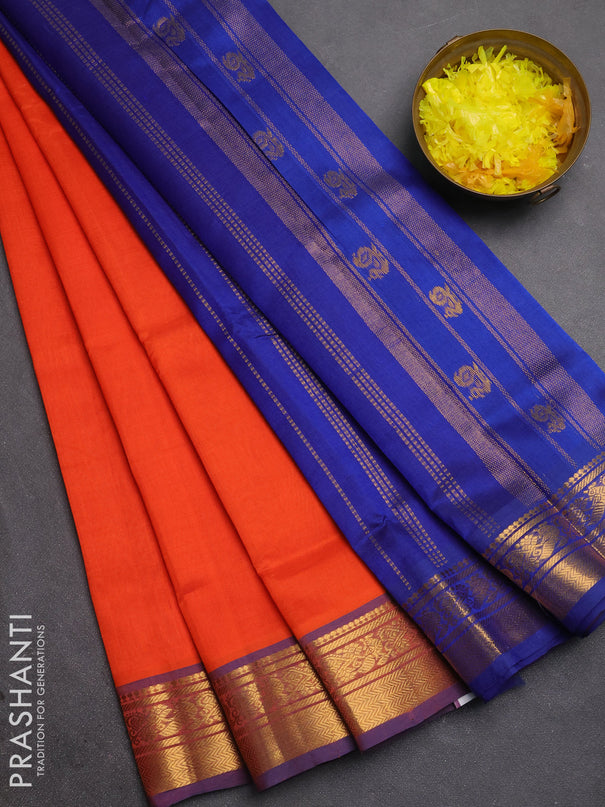 Silk cotton saree orange and navy blue with plain body and zari woven border