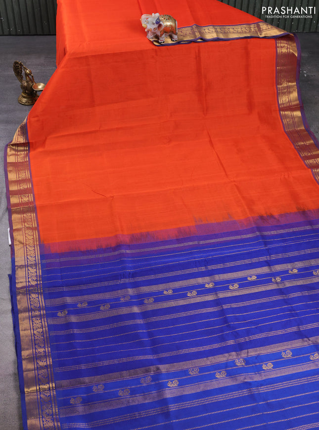 Silk cotton saree orange and navy blue with plain body and zari woven border