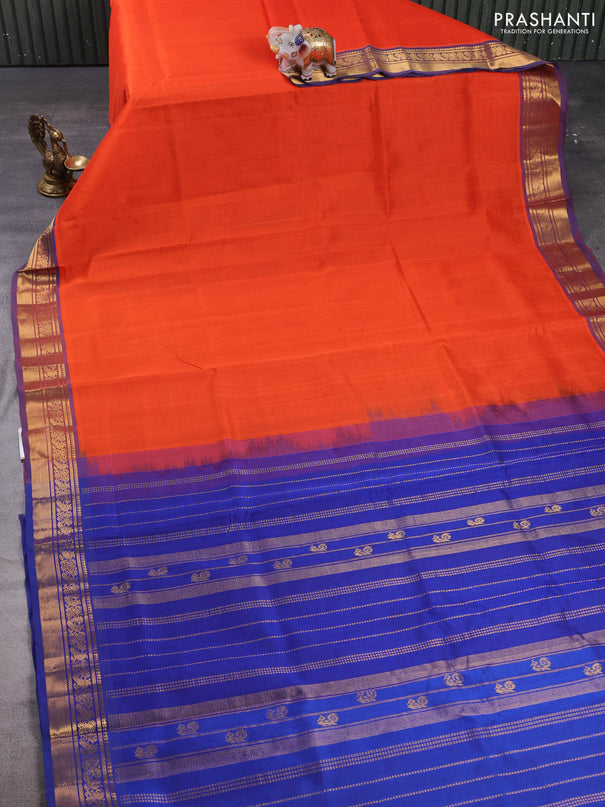 Silk cotton saree orange and navy blue with plain body and zari woven border
