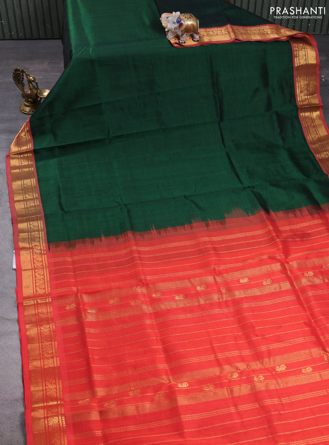 Silk cotton saree bottle green and red with plain body and zari woven border