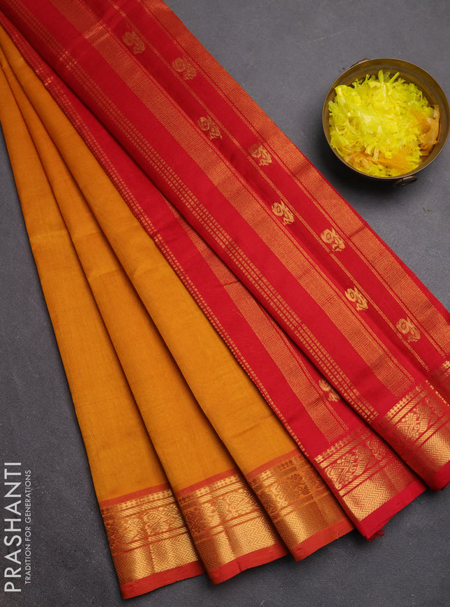 Silk cotton saree mustard yellow and red with plain body and zari woven border