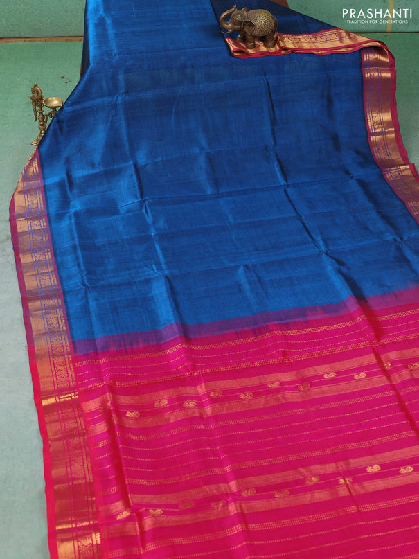 Silk cotton saree peacock blue and pink with plain body and zari woven border
