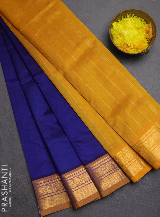 Silk cotton saree blue and mustard yellow with plain body and zari woven border