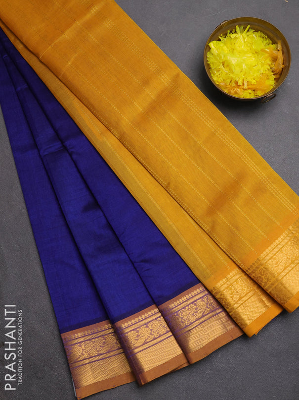 Silk cotton saree blue and mustard yellow with plain body and zari woven border