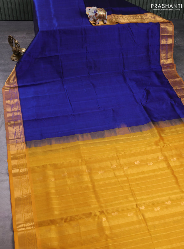 Silk cotton saree blue and mustard yellow with plain body and zari woven border