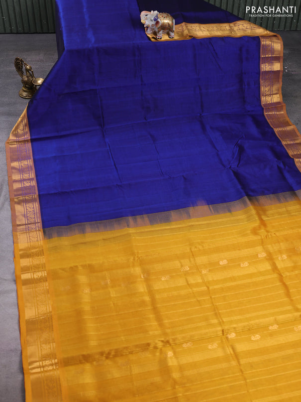 Silk cotton saree blue and mustard yellow with plain body and zari woven border