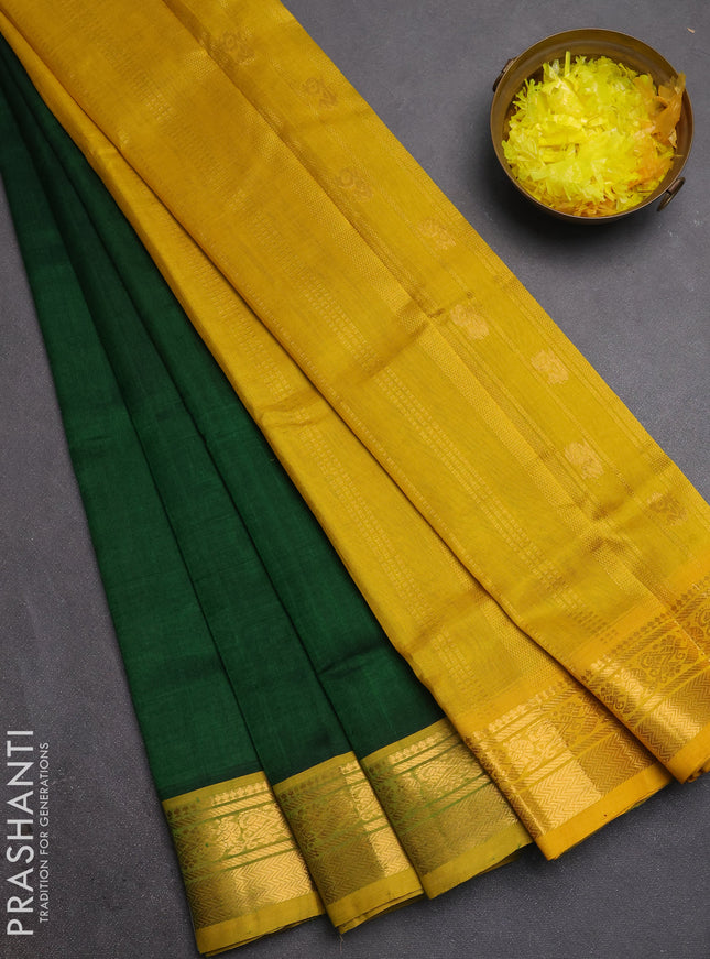 Silk cotton saree bottle green and mustard yellow with plain body and zari woven border