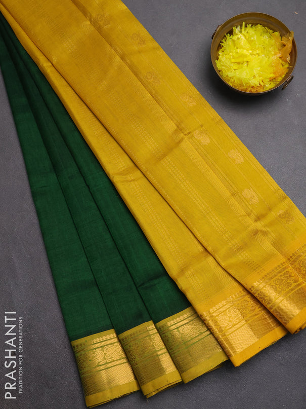 Silk cotton saree bottle green and mustard yellow with plain body and zari woven border