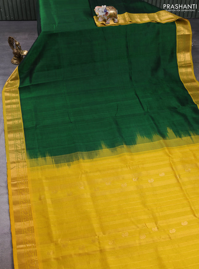 Silk cotton saree bottle green and mustard yellow with plain body and zari woven border