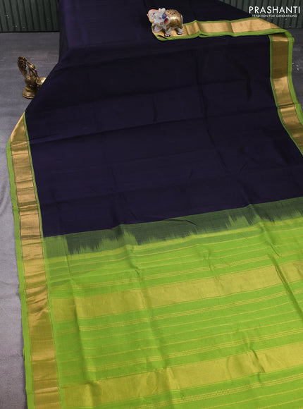Silk cotton saree black and light green with plain body and zari woven border