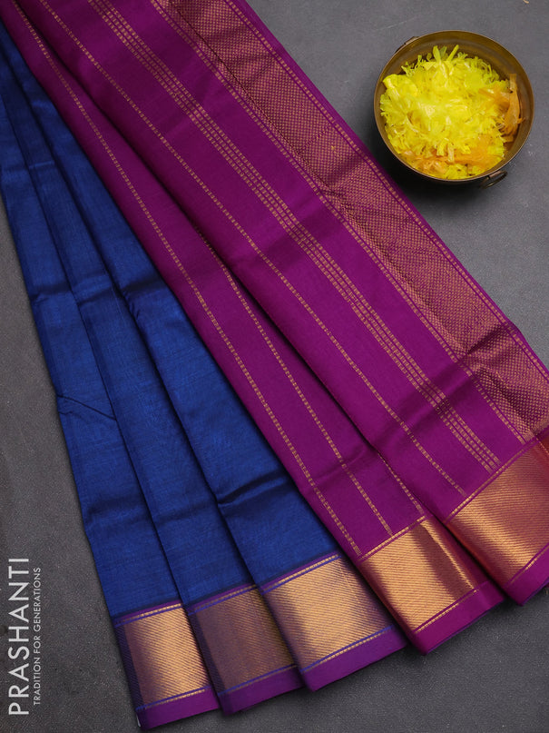 Silk cotton saree peacock blue and purple with plain body and zari woven border