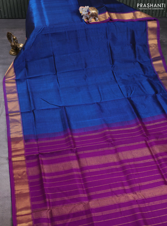 Silk cotton saree peacock blue and purple with plain body and zari woven border