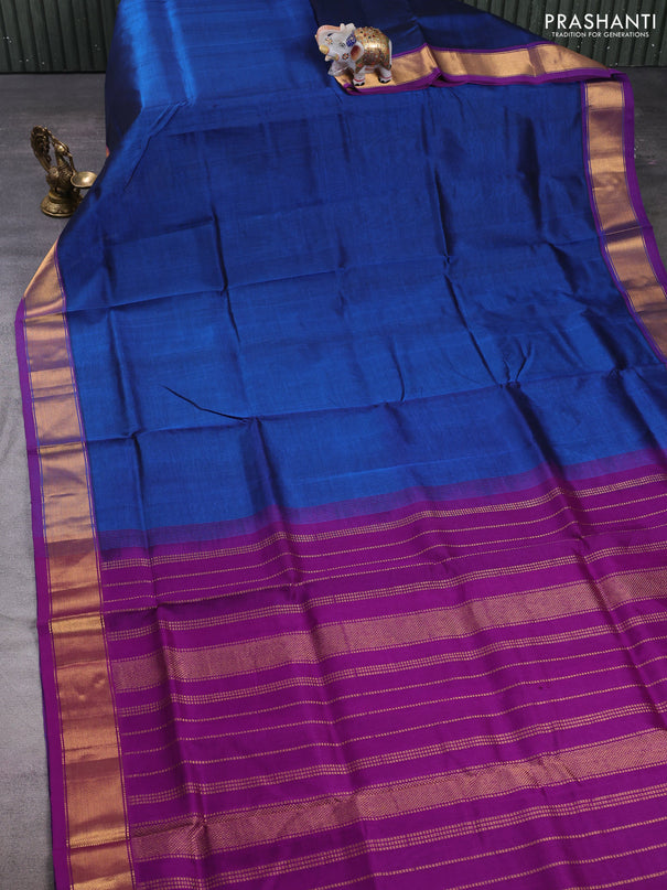 Silk cotton saree peacock blue and purple with plain body and zari woven border