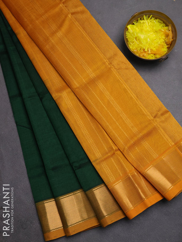 Silk cotton saree bottle green and mustard green with plain body and zari woven border