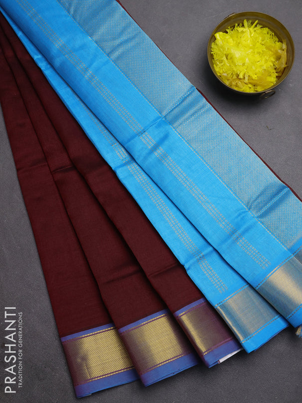 Silk cotton saree maroon and cs blue with plain body and zari woven border