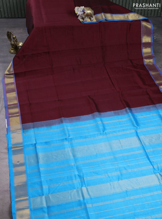 Silk cotton saree maroon and cs blue with plain body and zari woven border