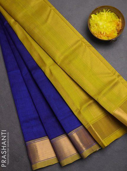 Silk cotton saree blue and mustard green with plain body and zari woven border