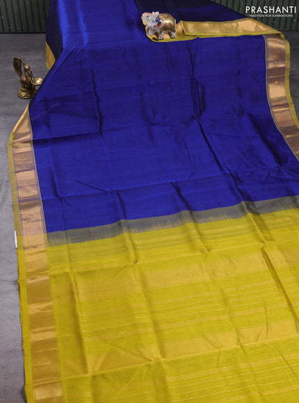 Silk cotton saree blue and mustard green with plain body and zari woven border