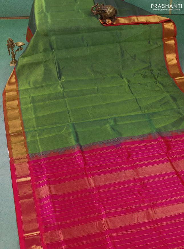 Silk cotton saree green and pink with plain body and zari woven border